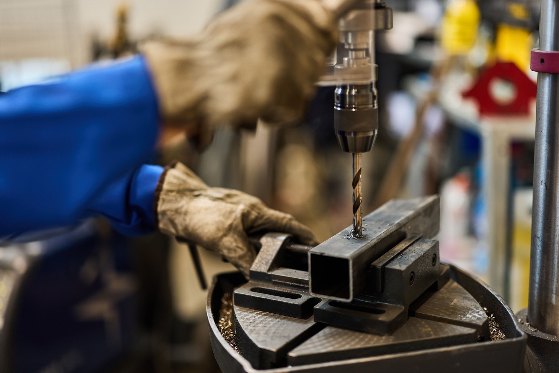 Industrial Worker Drilling Metal with Precision and Professional Tools in Workshop